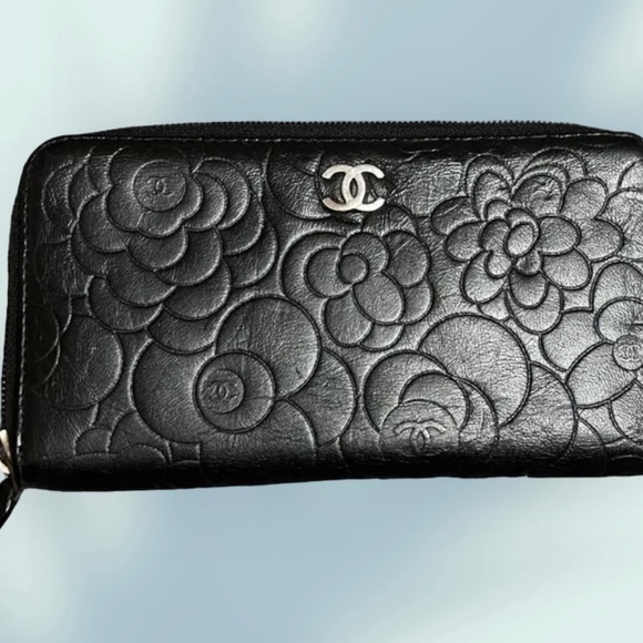 CHANEL Handbags - Chanel camellia black lambskin leather long zip around wallet